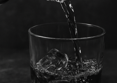 Whiskey pour into glass at cigar and whiskey lounge