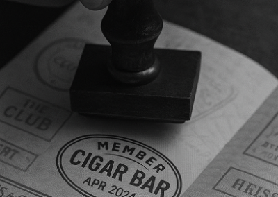 Stamped Ash & Ember Society passport for cigar lounge members