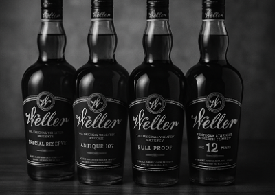 Lineup of premium Weller bourbon bottles at EDWINS Cigar Bar