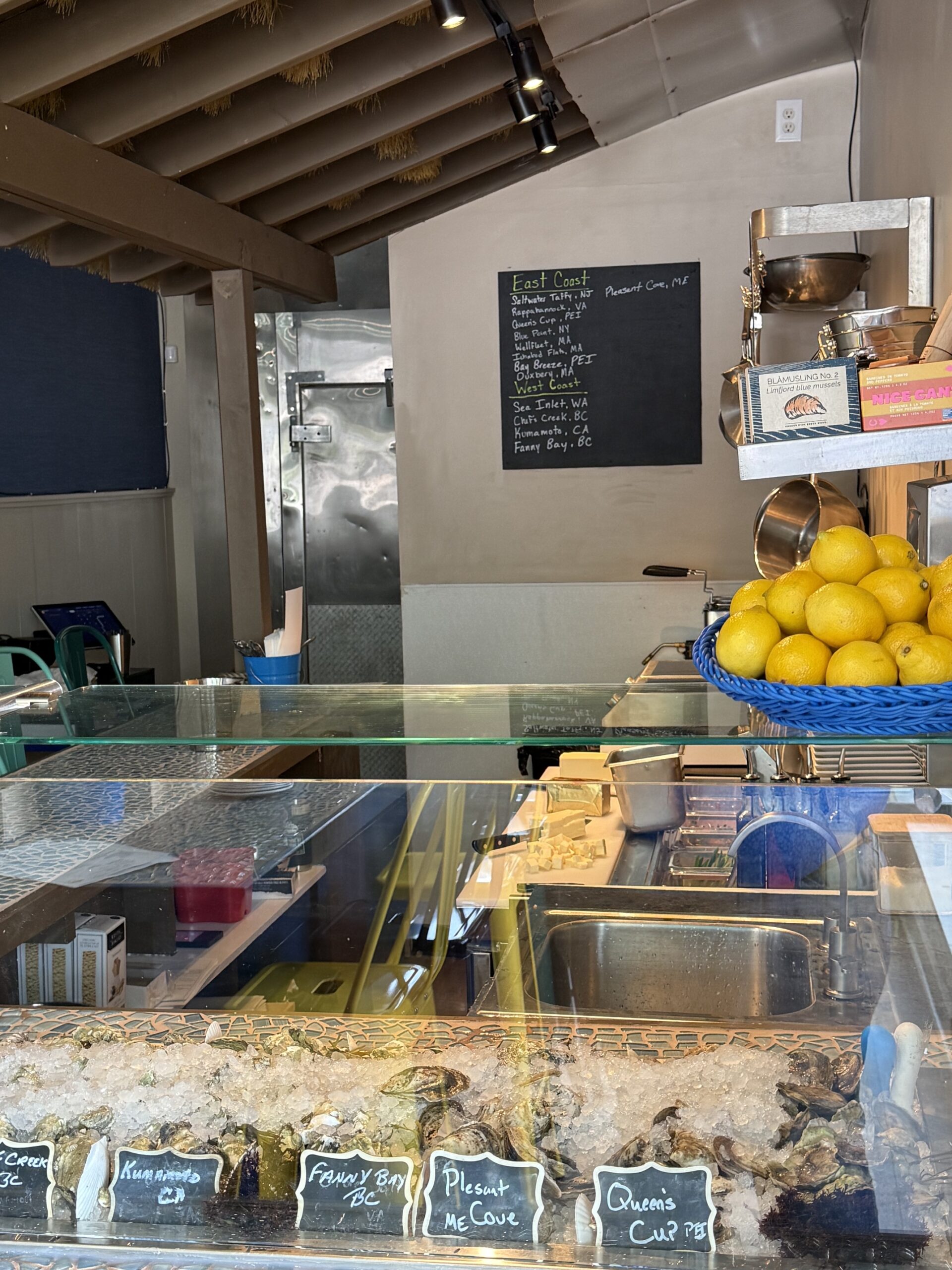 The chilled oyster display and shucking counter at EDWINS Oyster Bar
